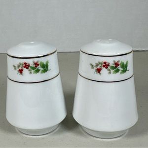 Salt and pepper shakers with holly berries and gold trim. Perfect for Christmas.